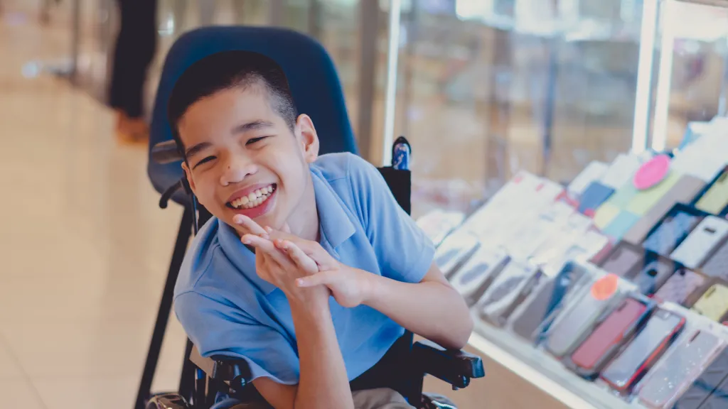 A boy in a wheelchair.